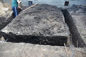 Beaverton worker digging home foundation